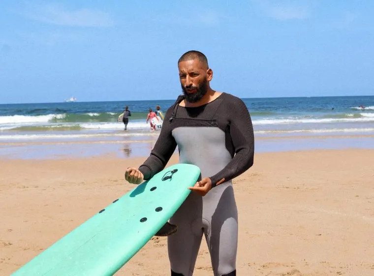Jamal giving a surf briefing to Morocco Surf Club guests before entering the water